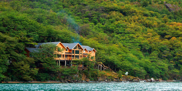 Aguas Arriba Lodge, a wooden cabin nestled in the Patagonian wilderness.