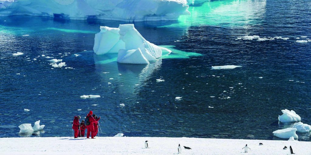 People in Antarctica shoe snowing