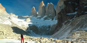 A hiker looking at the Paine Massif in Torres del Paine National Park, Chile.