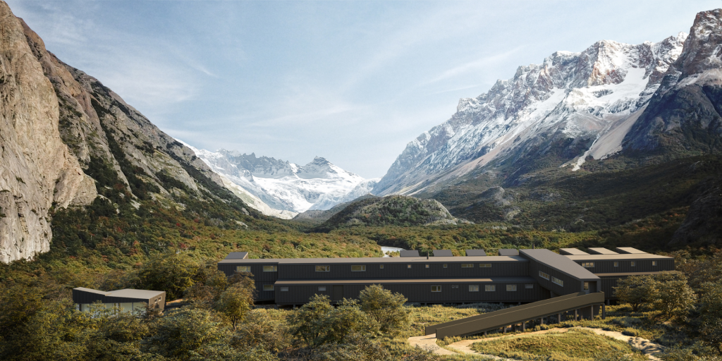 Panoramic view of Explora El Chaltén lodge in Patagonia, Argentina, with mountains and forests in the background.