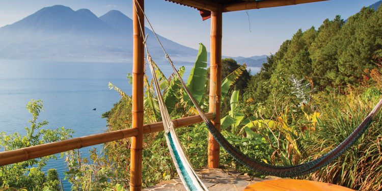 Hammocks on a terrace with view of Lake Atitlan in Guatemala Contours Travel