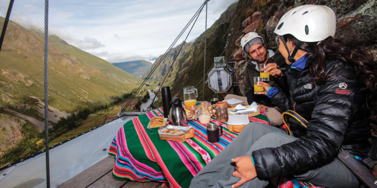 Gourmet breakfast served inside a Skylodge capsule with a mountain view.