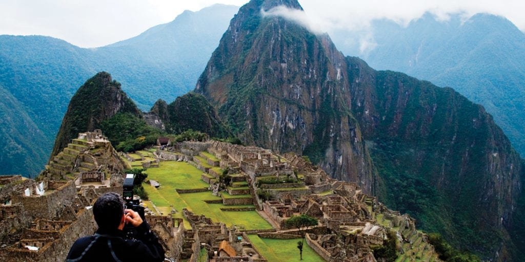 A breathtaking view of Machu Picchu, an ancient Incan city nestled among mountains.