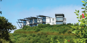 A modern hotel building nestled on a hilltop in the Galapagos Islands