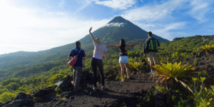 Travellers enjoying the view of Arenal Volcano, Costa Rica.
