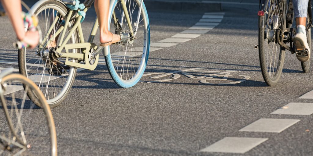 Cyclists biking along a bike path