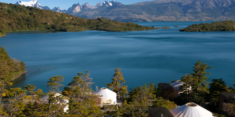 Luxury tent camp at Patagonia Camp with lake and mountain vista, Torres del Paine National Park.