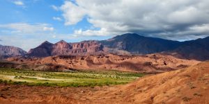 A panoramic view of the red rock formations and valleys in Quebrada de Cafayate.