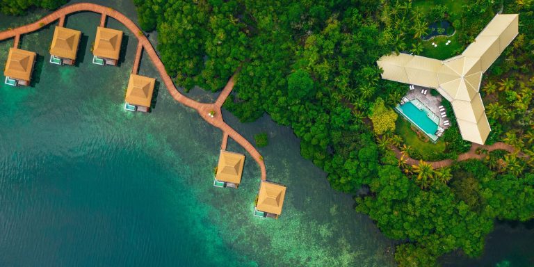Aerial view of Nayara Bocas del Toro, a luxury resort with overwater villas.
