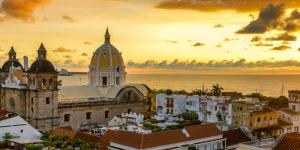 Aerial view of the colorful, historic city of Cartagena de Indias, Colombia, at sunset.