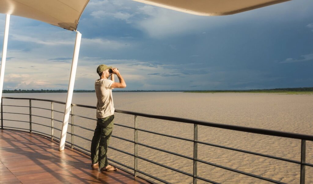 MV Zafiro at sunset as it travels on the Amazon River