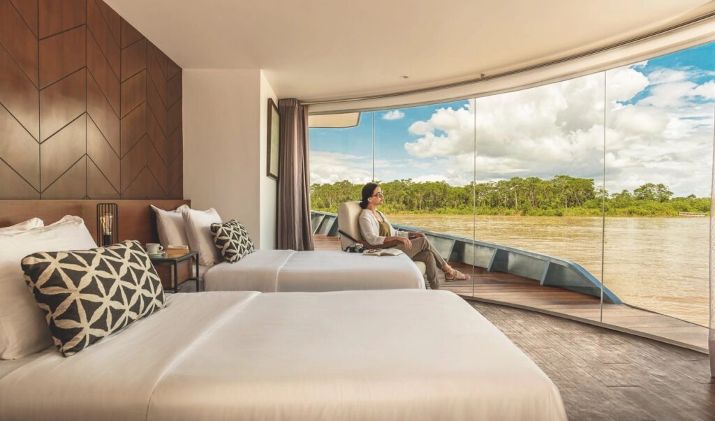 MV Zafiro cabin with guests on the Amazon River