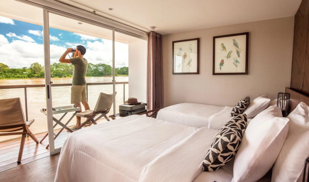 MV Zafiro cabin with guests on the Amazon River