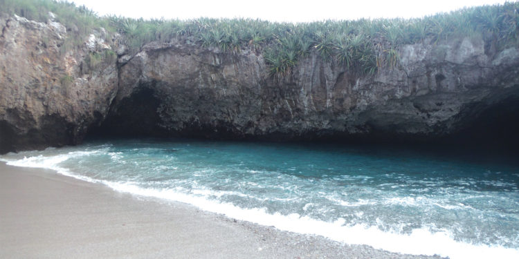 Inside of the Hidden Beach at Marieta Islands, Mexico. Contours Travel